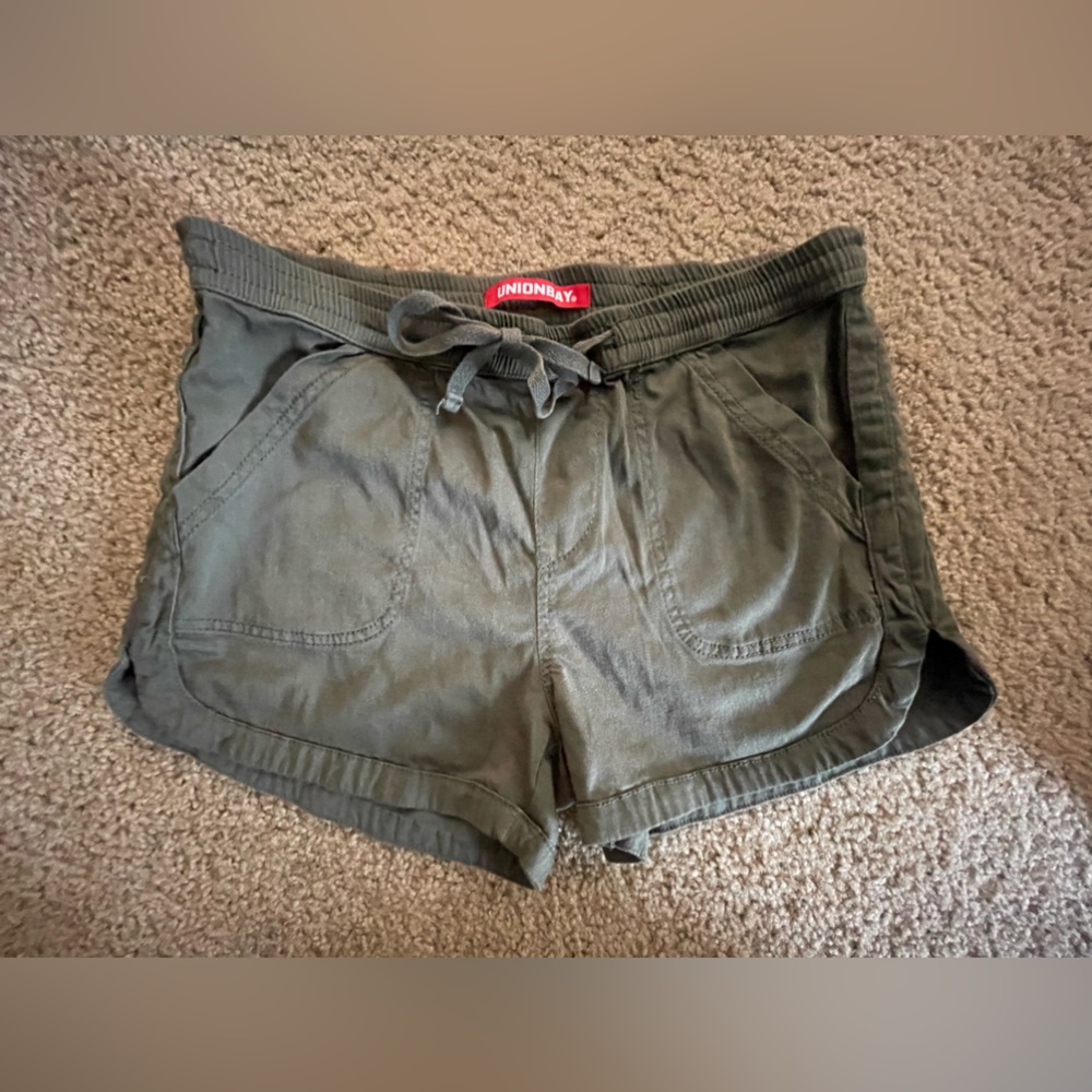 Army, green shorts with front pockets and back pockets- back pockets are fake